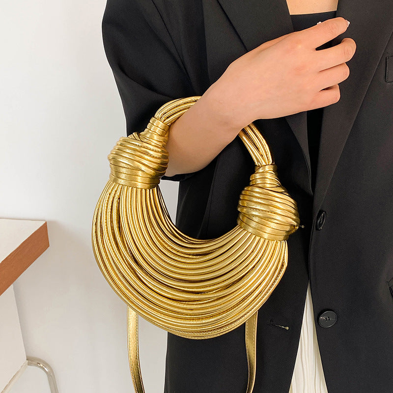 “Instafamous shiny metal noodle underarm bag in gold with chain strap”